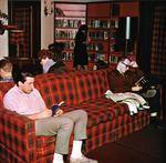 Students on Plaid Sofa in Library